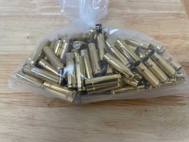 Bag of 100 new 300 AAC Blackout primed brass casings without powder or bullets.